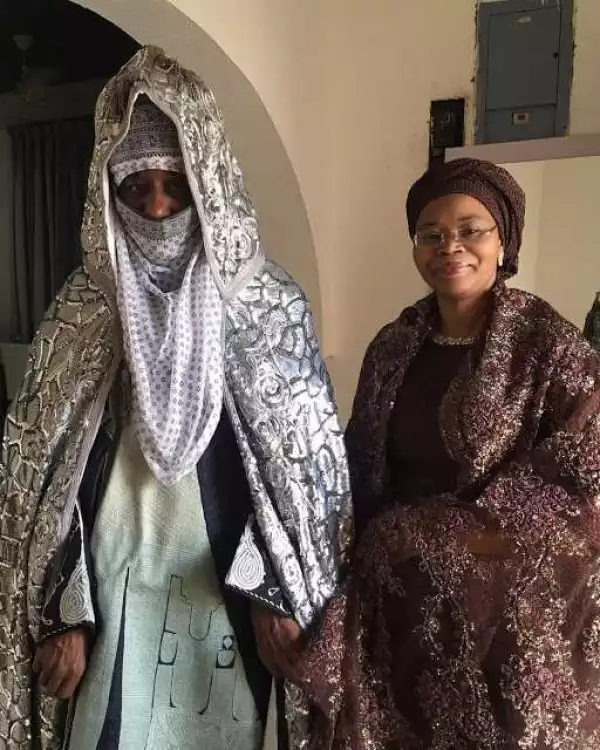 Proud grandparents Emir of Kano & wife take a pose